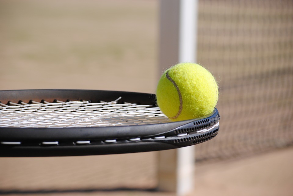 Tennis ball and racquet