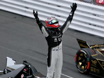 Mitch Evans on top of his Jaguar, celebrating his maiden Monaco ePrix win