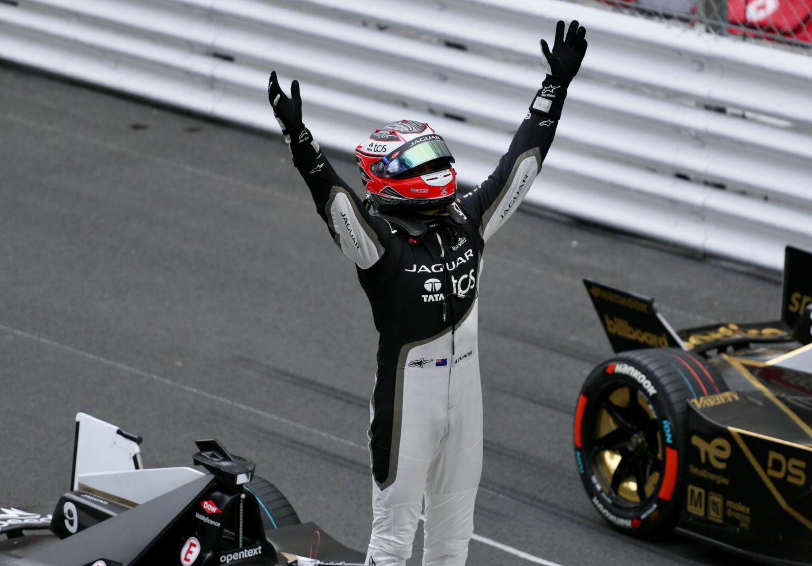 Mitch Evans on top of his Jaguar, celebrating his maiden Monaco ePrix win