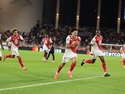 Akliouche celebrates with his Monaco teammates as they take the lead against Barcelona in the Champions League.