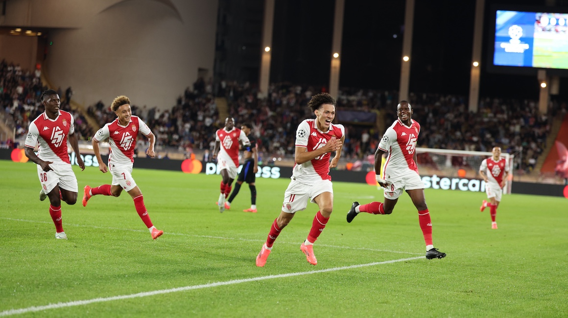 Akliouche celebrates with his Monaco teammates as they take the lead against Barcelona in the Champions League.