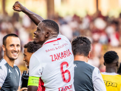 AS Monaco's Denis Zakaria celebrates by gesturing to the crowd at the Stade Louis II after giving his side a late lead against Lens