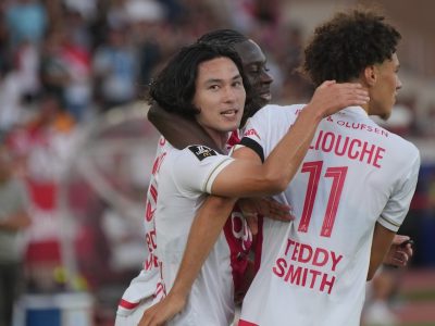 Minamino celebrating Monaco's last-minute winner against Strasbourg