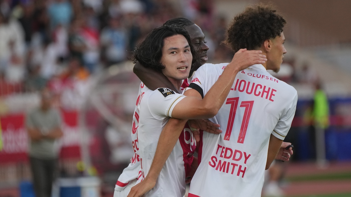 Minamino celebrating Monaco's last-minute winner against Strasbourg