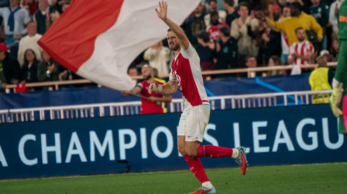 Eric Dier celebrates his equaliser for Monaco against Manchester City by waving to the home fans