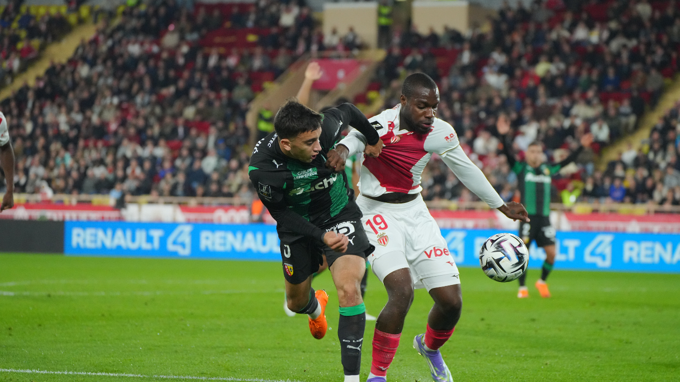 Monaco's Ilenikehna wrestles for the ball in Saturday night's defeat against Lens
