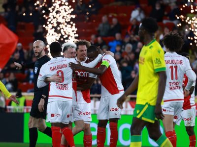 Zakaria celebrates with his Monaco teammates as he scores the Principality club's third against Nantes, as sparks go off in the background