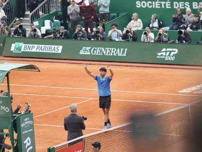 Alcaraz lifts his hands as he celebrates beating Sebastien Baez at the Monte-Carlo Masters