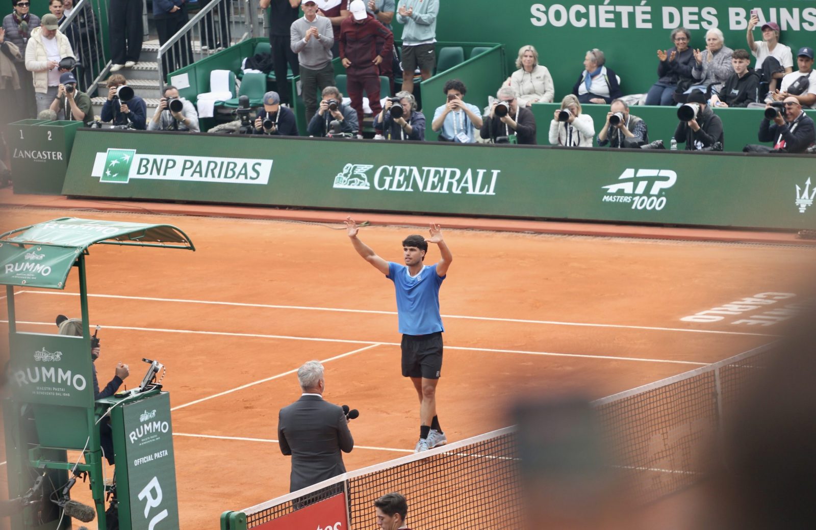 Alcaraz lifts his hands as he celebrates beating Sebastien Baez at the Monte-Carlo Masters