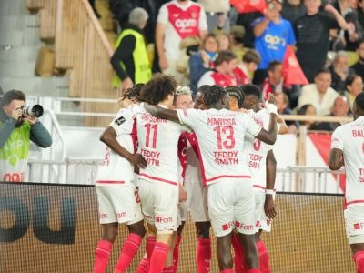Monaco players huddle after taking the lead at the Stade Louis II, against Marseille