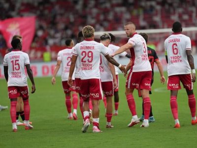 Brunner reaching out to high-five Dier after he put Monaco ahead against Górnik Zabrze