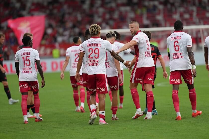 Brunner reaching out to high-five Dier after he put Monaco ahead against Górnik Zabrze