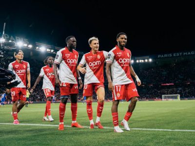 A smiling Idumbo is followed by his Monaco teammates as his side take the lead at the Parc des Princes