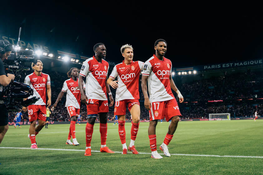 A smiling Idumbo is followed by his Monaco teammates as his side take the lead at the Parc des Princes